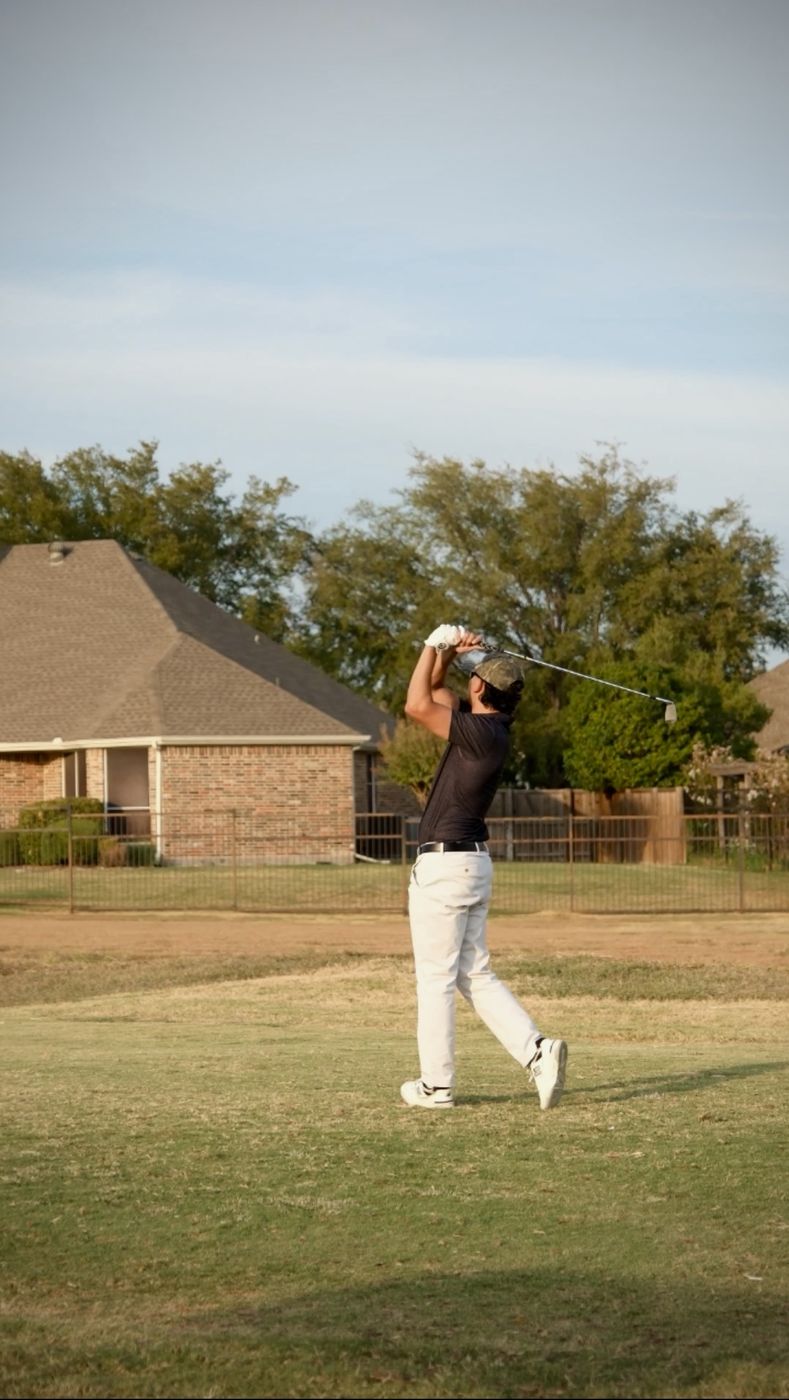 Prestige team member teeing off at a team golf outing