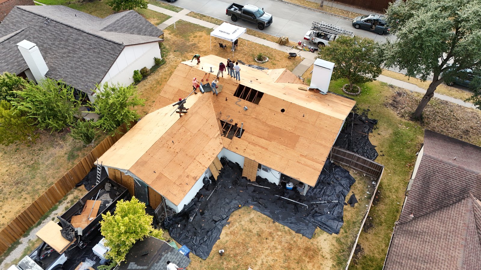 Aerial view of a Prestige crew replacing roof decking